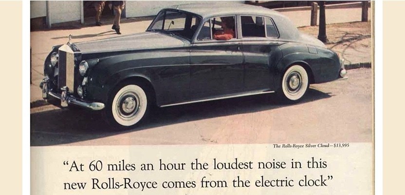 Classic Rolls-Royce Silver Cloud print advertisement: a two-tone Silver Cloud with the headline ‘At 60 miles an hour the loudest noise in this new Rolls-Royce comes from the electric clock.’